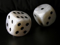 Two dice being rolled 